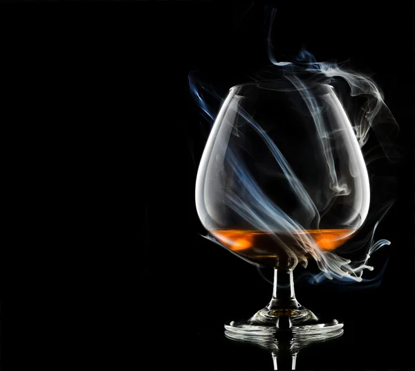 Cognac in smoke — Stock Photo, Image