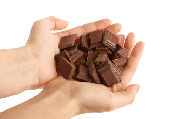 Hands holding blocks of Chocolate isolated on white background — Stock Photo, Image