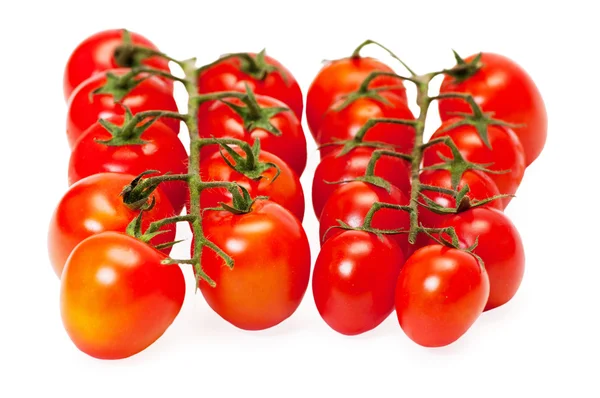 Tomates cherry aislados sobre fondo blanco —  Fotos de Stock