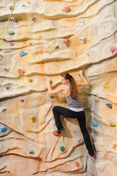 Woman on rock wal — Stock Photo, Image