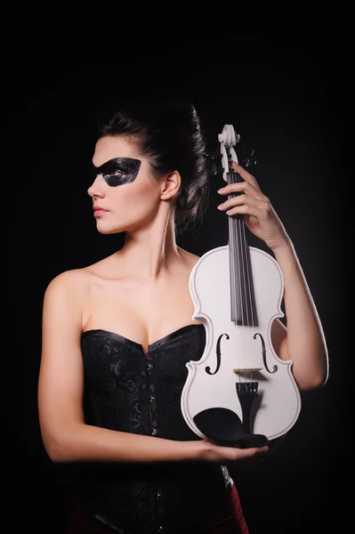 Sexy woman with black party mask and white violin — Stock Photo, Image