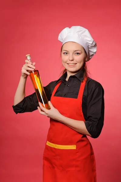 Belleza joven cocinero bodega botella — Foto de Stock