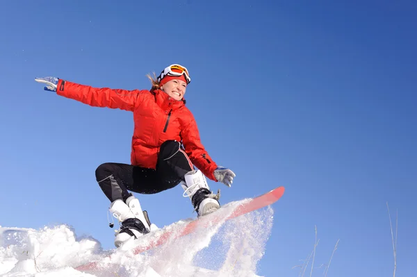 Vrouw op snowboard — Stockfoto