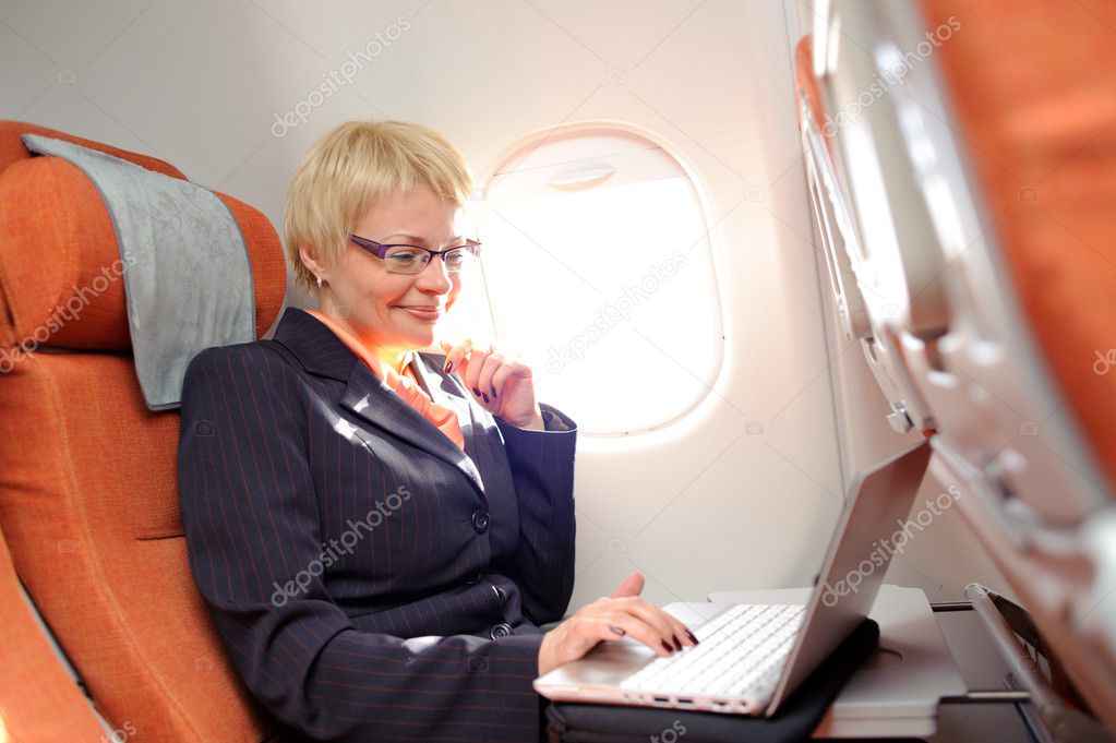 businesswomanon the board of plane