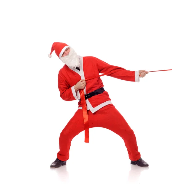 Noel Baba çekme kırmızı kurdele — Stok fotoğraf