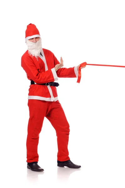 Santa Claus tira de cinta roja — Foto de Stock