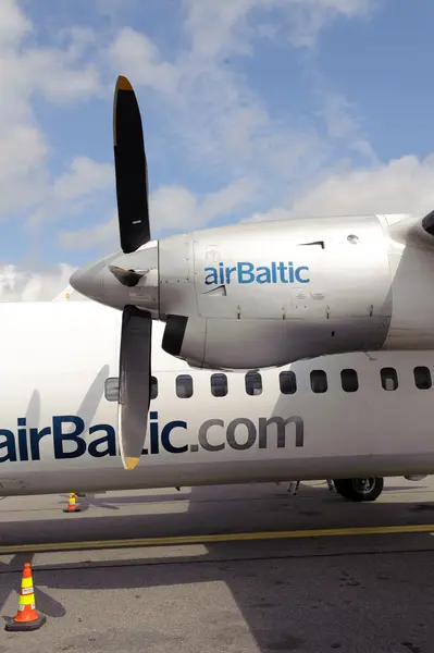 Air Baltic propeller airplane in Riga airport — Stock Photo, Image