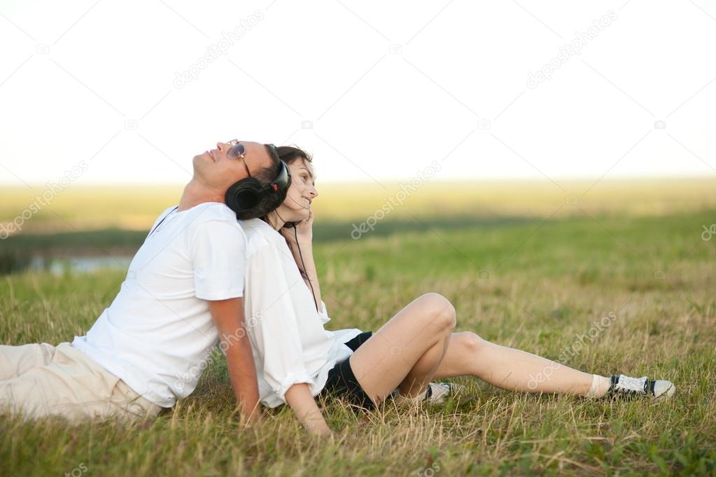 young couple listening to music