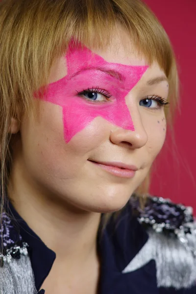 Teenager with pink star on the face — Stock Photo, Image