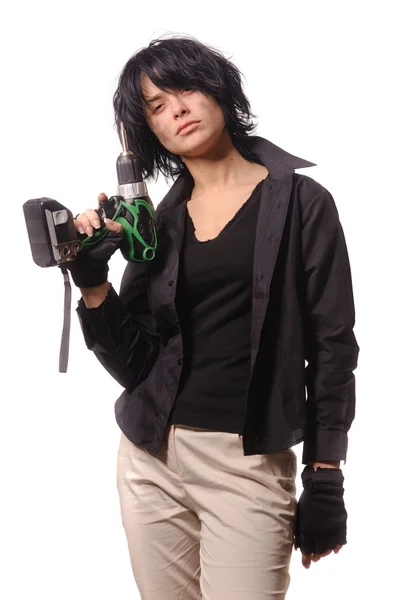 Woman with battery drill in black casual clothing — Stock Photo, Image