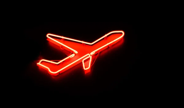 Znak samolotu w nocy — Zdjęcie stockowe