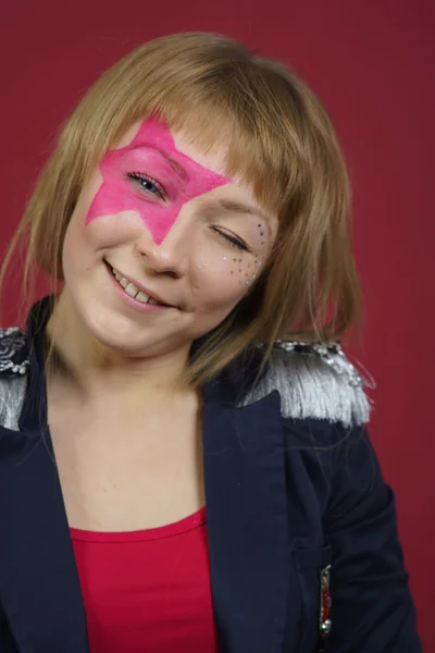 Teenager with pink star on the face — Stock Photo, Image