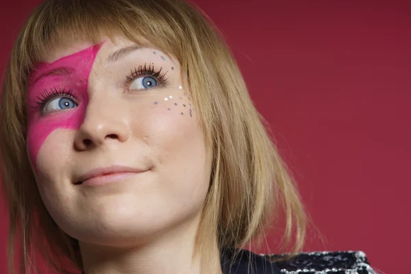 Teenager with pink star on the face — Stock Photo, Image