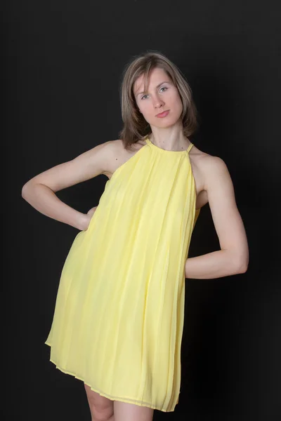 Girl in a yellow dress — Stock Photo, Image