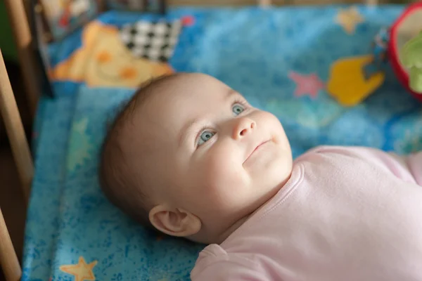 Baby in a crib — Stock Photo, Image