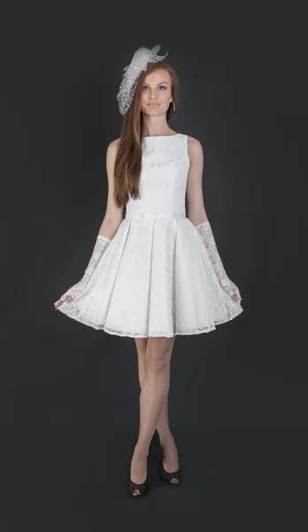 Slim girl in white evening dress — Stock Photo, Image