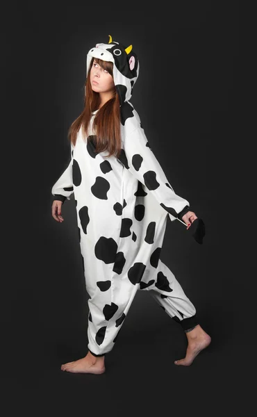 Girl in a cow costume — Stock Photo, Image