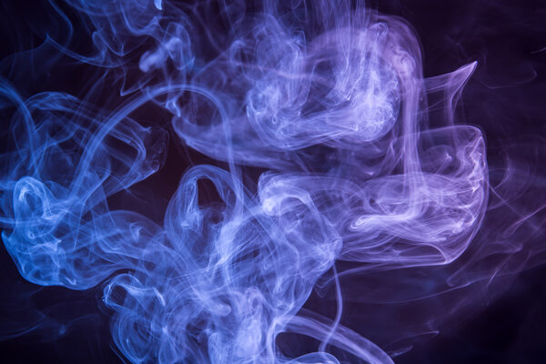 Abstract background of smoke in two colors on a black background