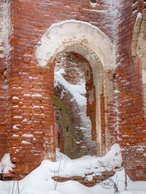 arch in the ruins of a noble estate under the snow, Russia, Leningrad region, the village of Torosovo
