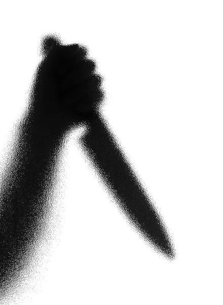 Knife in a hand. Silhouette. Photographed through the textured g — Stock Photo, Image