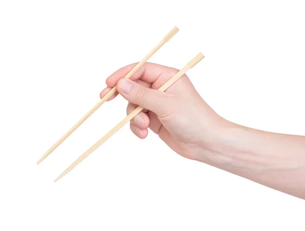 在白色背景上的手中的筷子 — 图库照片