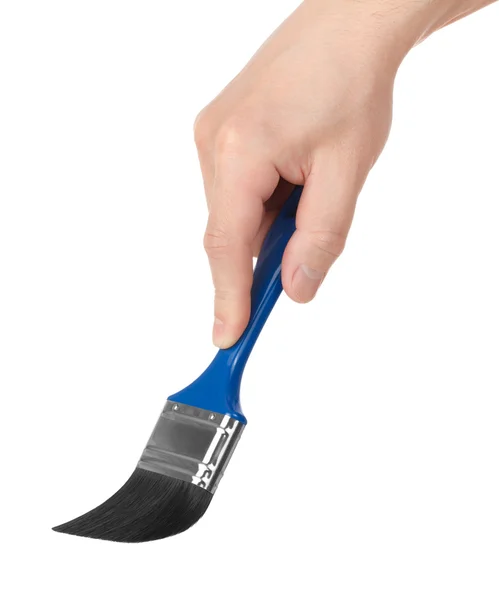 Brush in a hand on a white background — Stock Photo, Image