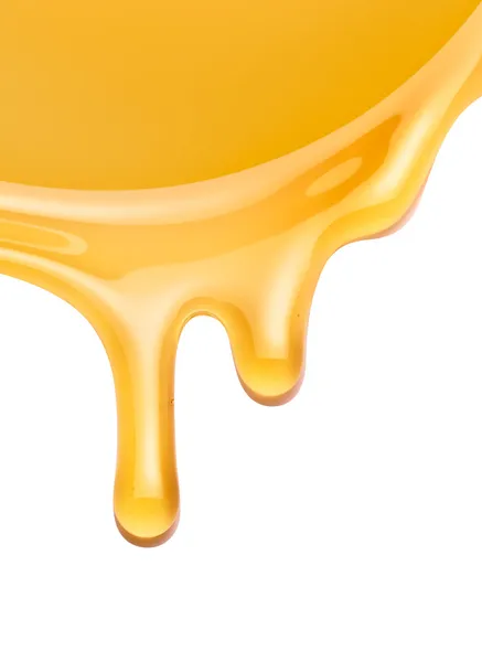 Miel que fluye sobre un fondo blanco — Foto de Stock