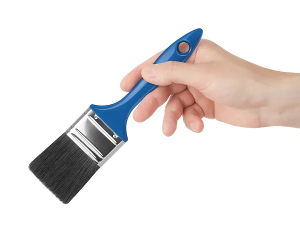 Paint brush in a hand on a white background — Stock Photo, Image