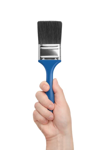 Brush in a hand on a white background — Stock Photo, Image