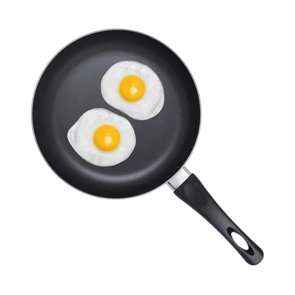 Fried eggs. Pan with handle on white background — Stock Photo, Image