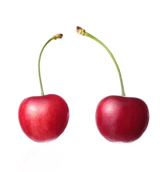 Duas cerejas em um fundo branco — Fotografia de Stock