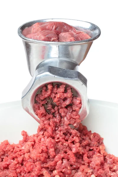 Raw meat in a meat grinder — Stock Photo, Image