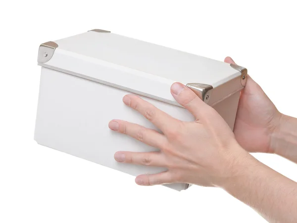 Hands pass someone a box — Stock Photo, Image