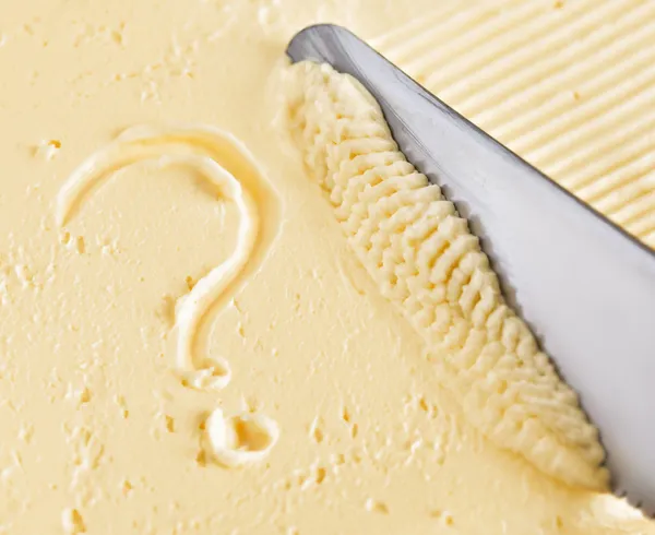 Масло, нож — стоковое фото