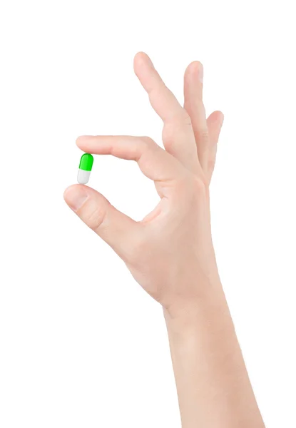 Pill in hand on white background — Stock Photo, Image