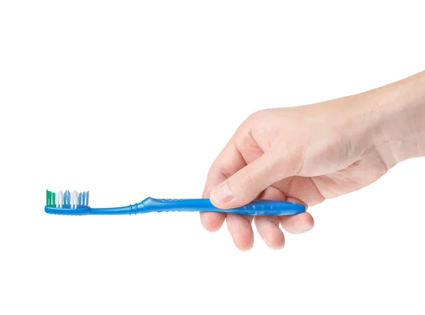 Tandenborstel in een mannenhand — Stockfoto