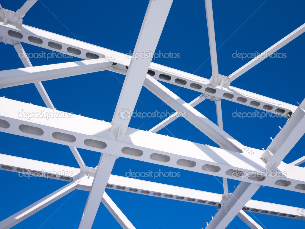 Steel beams against the blue sky