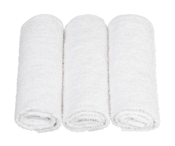 Zusammengerollte Handtücher auf weißem Hintergrund — Stockfoto