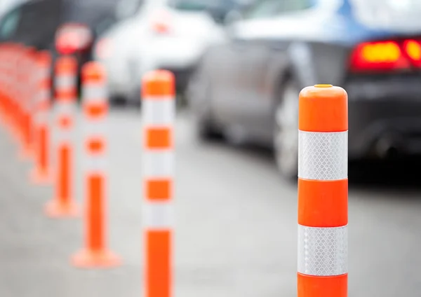 Orange bollard on the road. Traffic jam. — Stock Photo, Image