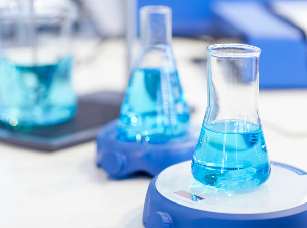 flasks with blue liquid in the chemical laboratory