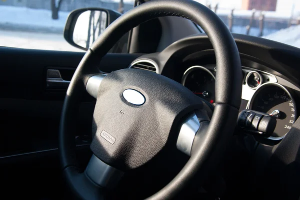 Black automobile steering with airbag Stock Picture