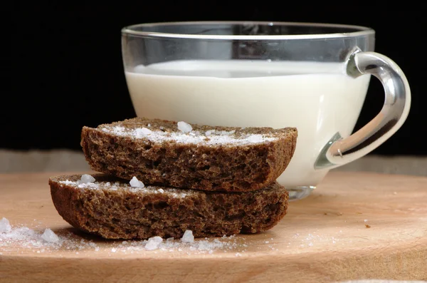 Rye bread with salt and a cup of milk — Stock Photo, Image