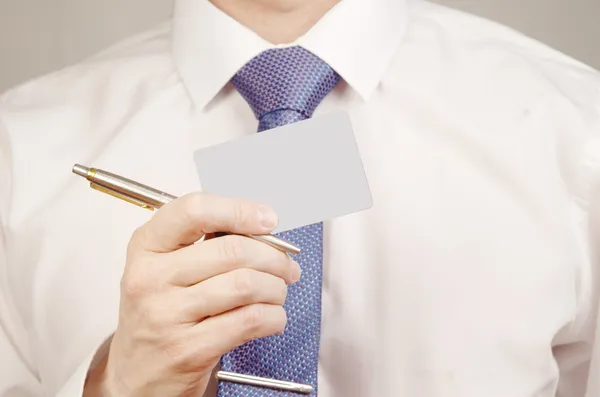 Hand holding pen and credit card — Stock Photo, Image