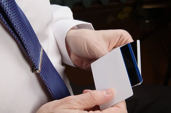 Businessman holding credit cards — Stock Photo, Image