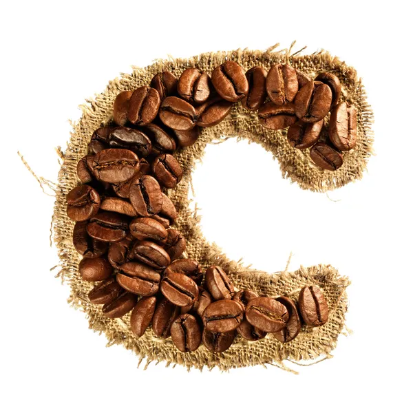 Alfabet van koffiebonen op stof textuur geïsoleerd op wit — Stockfoto