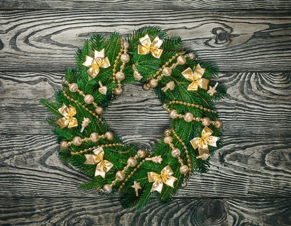 Christmas wreath over old wood background — Stock Photo, Image