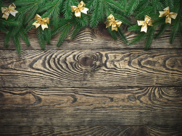 Christmas fir tree with decoration on a wooden board — Stock Photo, Image