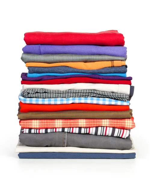 Stacks of colorfull clothes on white background — Stock Photo, Image