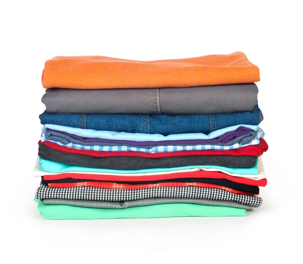 Stacks of colorfull clothes on white background — Stock Photo, Image