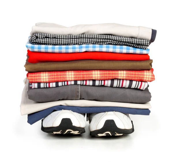 Stacks of colorfull clothes on white background — Stock Photo, Image